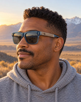 Mount Whitney polarized sunglasses worn by a man at an Owens Valley overlook with the Sierra behind