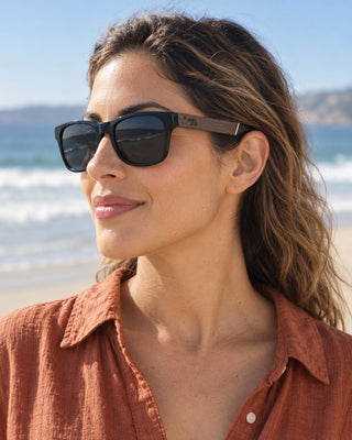 Pismo Beach polarized sunglasses worn by a woman on the beach at Pismo Beach