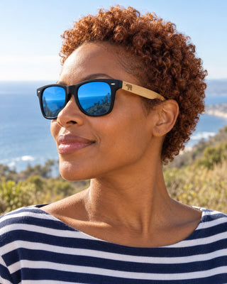 Santa Barbara polarized sunglasses worn by a woman on a hillside trail above the Santa Barbara coast