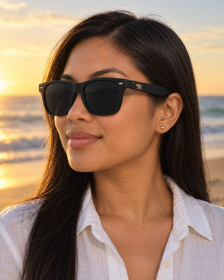 Santa Monica polarized sunglasses worn by a woman at Santa Monica Beach at golden hour