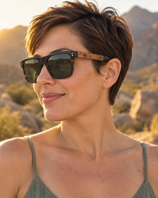 Toro Peak polarized sunglasses worn by a woman on a desert mountain trail in the Santa Rosa Mountains